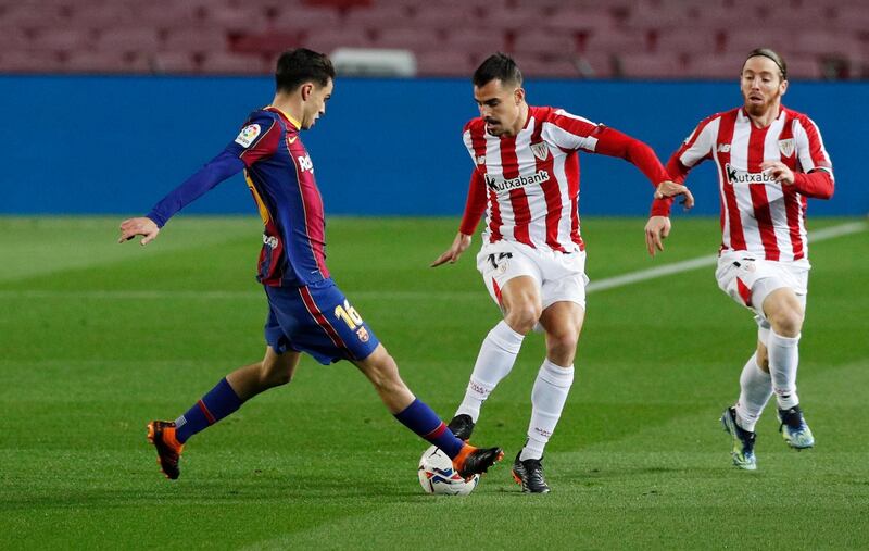 Soccer Football - La Liga Santander - FC Barcelona v Athletic Bilbao - Camp Nou, Barcelona, Spain - January 31, 2021 Barcelona's Pedri in action with Athletic Bilbao's Dani Garcia REUTERS/Albert Gea