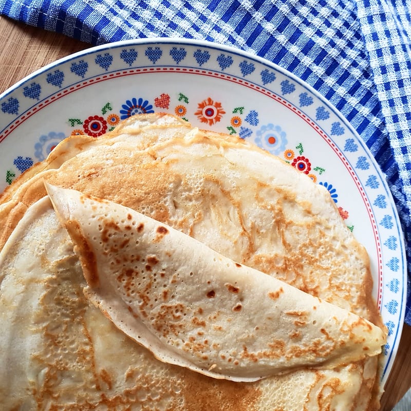 Pancakes made from rich ingredients are traditionally eaten on Shrove Tuesday before the abstinence period of Lent. Unsplash