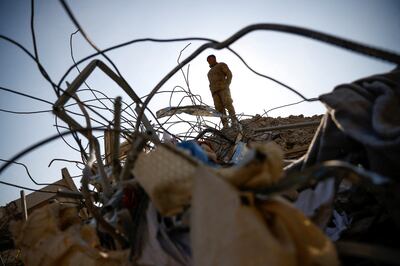 A member of the army stands amid rubble, in the aftermath of the deadly earthquake in Kahramanmaras, Turkey, on February 12. Reuters