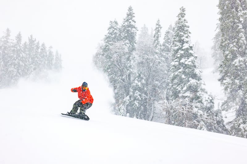 A snowboarder descends a mountain after one of the most significant storms of the season in Big Bear Lake. AP
