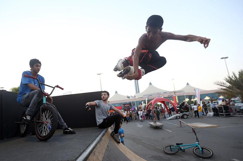 Ahmed Alaa, 14, uses a ramp set up at the Abu Dhabi International Show to perform a few tricks in Abu Dhabi. Sammy Dallal / The National