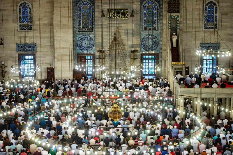 Muslim worshippers perform Eid Al Fitr prayers at the Suleymaniye mosque on June 4, 2019 in Istanbul. AFP