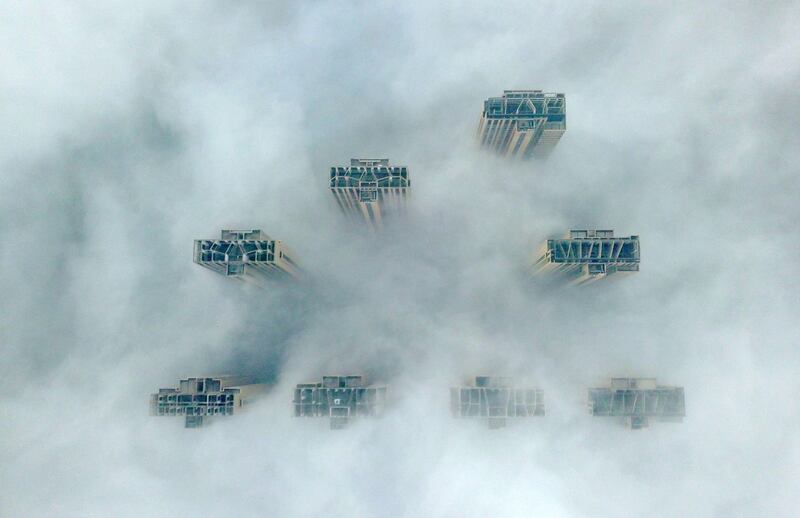 This aerial view shows the tops of highrise buildings poking out from heavy fog in Yangzhou, in China's eastern Jiangsu province. AFP