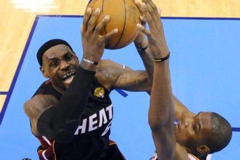 LeBron James, left, defended here by Oklahoma City Thunder's Kevin Durant, has been outstanding in the opening two games of the NBA finals. And Durant has been just as good.