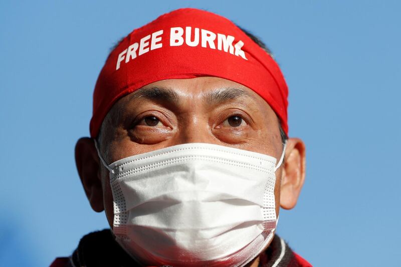Protester wearing "Free Burma" headwear rallies against Myanmar's military after it seized power from a democratically elected civilian government and arrested its leader Aung San Suu Kyi, at United Nations University in Tokyo, Japan February 1, 2021. REUTERS/Issei Kato