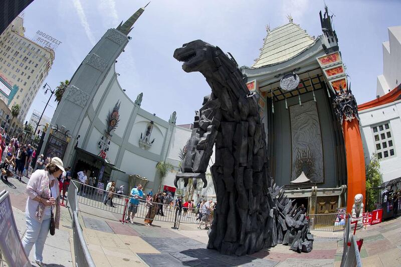 A 20-foot statue of Godzilla towers over the forecourt of the TCL Chinese Theatre in Hollywood, California on May 9, 2014 after it was unveiled. The latest version of the giant amphibian will hit the 3D screen at the TCL Chinese Theatre and across the United States on May 16. Robyn Beck / AFP