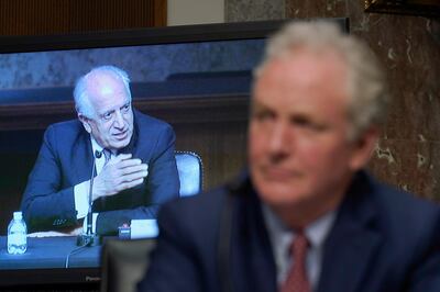 Sen. Chris Van Hollen, D-Md., right, listens as Zalmay Khalilzad, special envoy for Afghanistan Reconciliation, left, testifies before the Senate Foreign Relations Committee on Capitol Hill in Washington, April 27, 2021, during a hearing on the Biden administration's Afghanistan policy and plans to withdraw troops after two decades of war. (AP Photo/Susan Walsh, Pool)