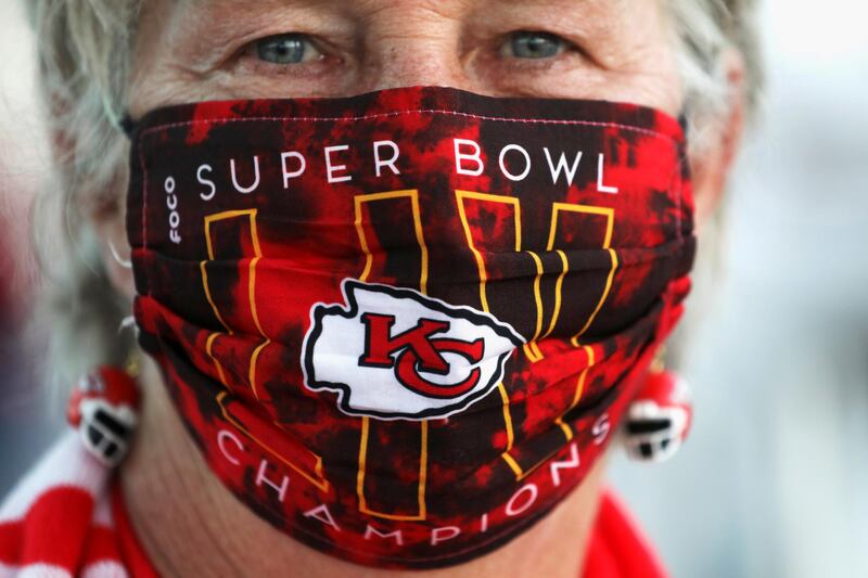 A Kansas City Chiefs fan wears a themed face mask ahead of the weekend's Super Bowl LV between the Kansas City Chiefs and Tampa Bay Buccaneers in Tampa, Florida, US. Reuters