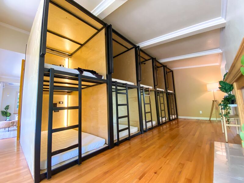 Bunks include a privacy curtain and an electrical socket. 