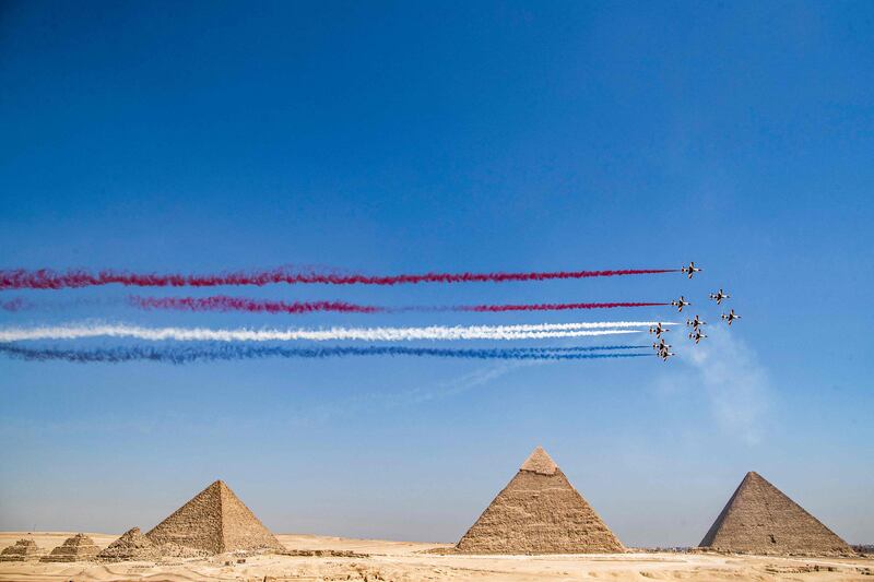 The Egyptian Air Force Silver Stars aerobatic team perform during the Pyramids Air Show 2022. Photos: AFP and Reuters