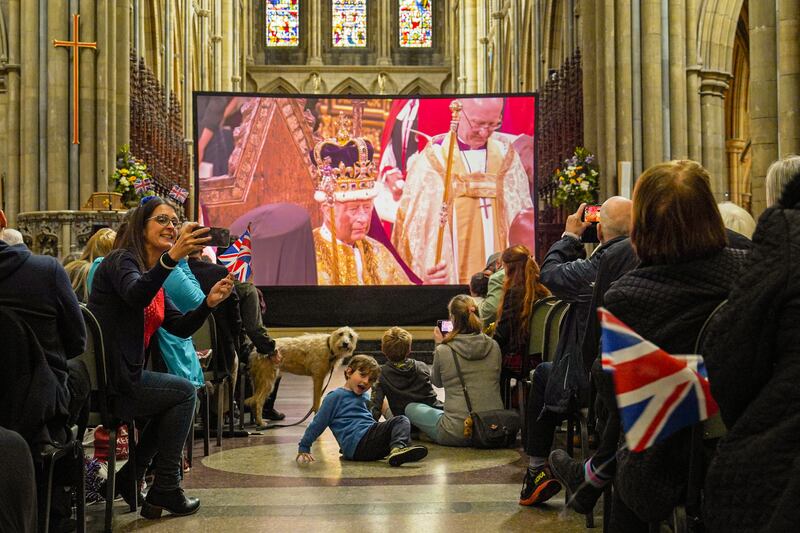People watch a live screening of the coronation, inside Truro Cathedral, England. Getty Images