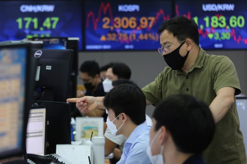 Currency traders watch monitors at the foreign exchange dealing room of the KEB Hana Bank headquarters in Seoul, South Korea. AP Photo