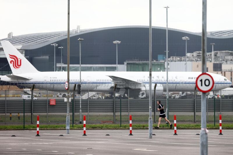 A man exercises in the car park of the Renaissance London Heathrow Hotel. Reuters