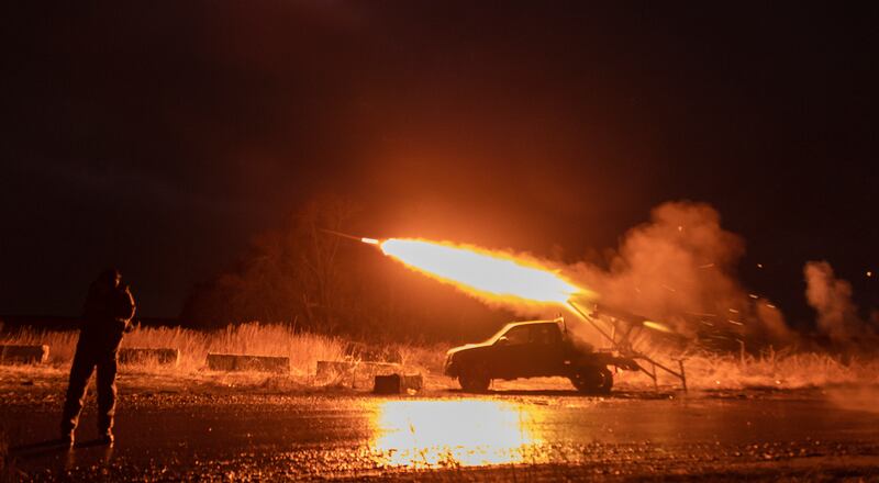 Ukrainian servicemen fire a self-made rocket launcher on a front line in the Donetsk area. EPA