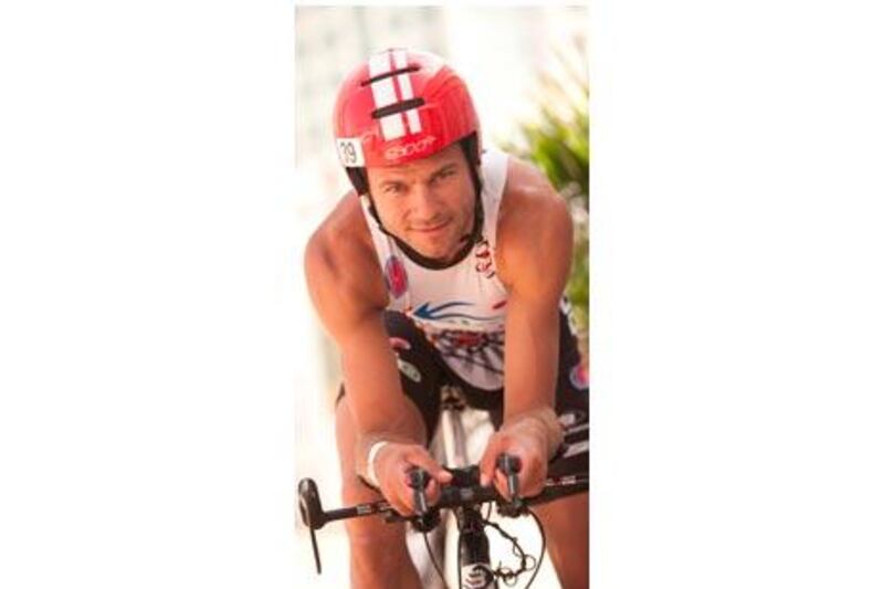 Rob Woestenborghs completed the Abu Dhabi Triathlon yesterday despite a bike crash that left him in a coma in 2008.