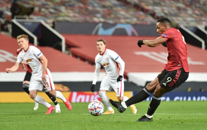 Anthony Martial makes it 4-0 from the penalty spot. EPA