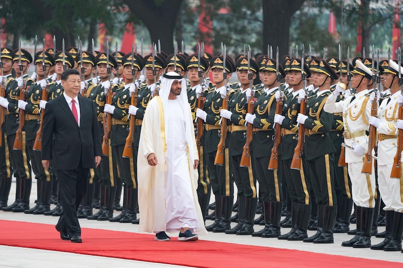 BEIJING, CHINA - July 22, 2019: HH Sheikh Mohamed bin Zayed Al Nahyan, Crown Prince of Abu Dhabi and Deputy Supreme Commander of the UAE Armed Forces (R) and HE Xi Jinping, President of China (L), inspect the Guard of Honour during a reception, at the Great Hall of the People.

( Hamad Al Mansoori for the Ministry of Presidential Affairs )
---