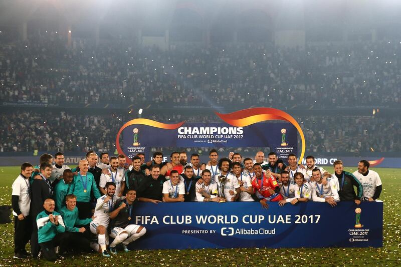 ABU DHABI, UNITED ARAB EMIRATES - DECEMBER 16:  The Real Madrid team celebrate with the Trophy after the FIFA Club World Cup UAE 2017 Final between Gremio and Real Madrid at the Zayed Sports City Stadium on December 16, 2017 in Abu Dhabi, United Arab Emirates.  (Photo by Francois Nel/Getty Images)
