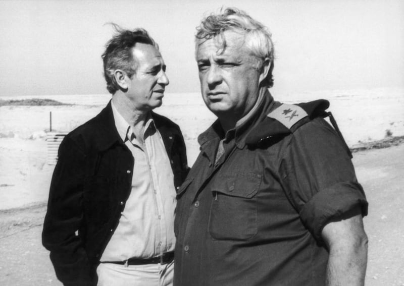 Shimon Peres, left, and Ariel Sharon visit Ras-Sudar in Egypt in 1975, an important site in the 1967 war. Getty Images