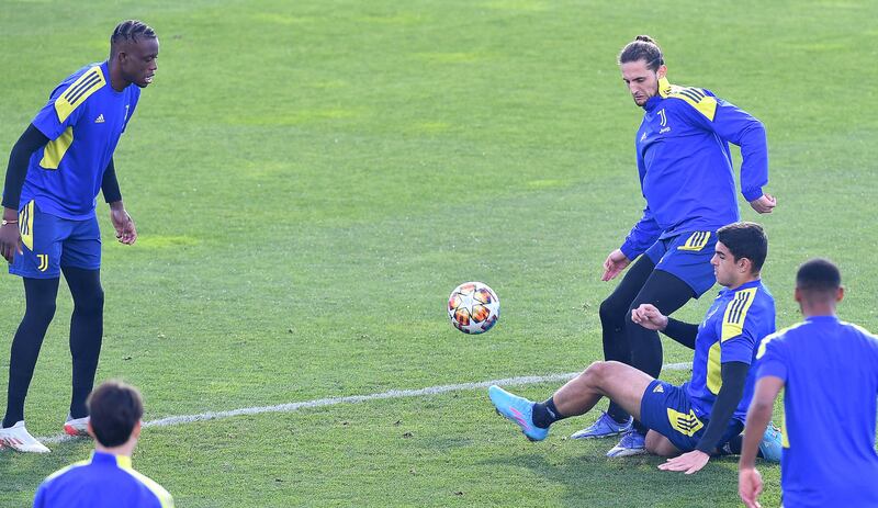 Juve's Adrien Rabiof, third from right, and Dennis Zakaria, left, during training. EPA 