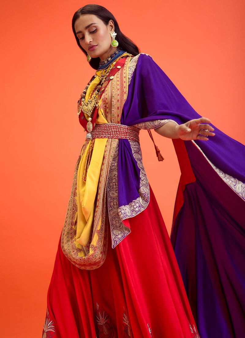 A lehenga with dual-draped dupattas cinched with a cummerbundfrom Anamika Khanna 