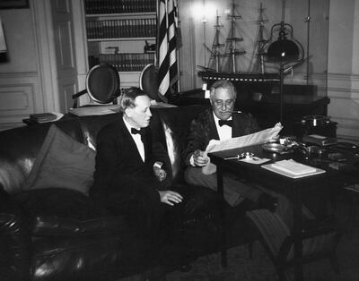 Franklin D. Roosevelt and Harry Hopkins, head of the Works Progress Administration, at work in the White House study. (Photo by © CORBIS/Corbis via Getty Images)