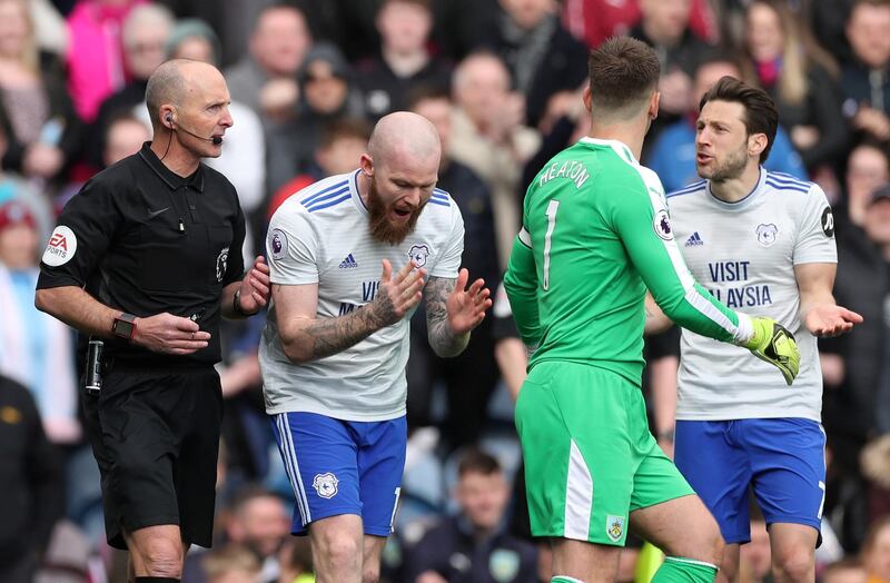 Soccer Football - Premier League - Burnley v Cardiff City - Turf Moor, Burnley, Britain - April 13, 2019  Cardiff City's Aron Gunnarsson remonstrates with referee Mike Dean         Action Images via Reuters/Lee Smith  EDITORIAL USE ONLY. No use with unauthorized audio, video, data, fixture lists, club/league logos or "live" services. Online in-match use limited to 75 images, no video emulation. No use in betting, games or single club/league/player publications.  Please contact your account representative for further details.