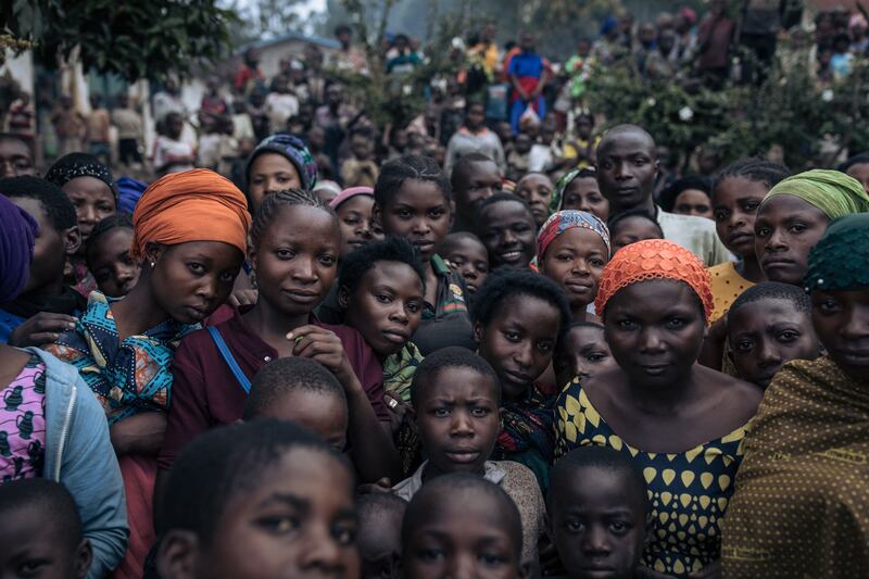 Dozens of war-displaced people pack the courtyard of a school where they have taken refuge in Minova, South Kivu province, in the east of the Democratic Republic of Congo.  Humanitarian aid for the nearly 300,000 displaced people in Minova is almost non-existent. AFP