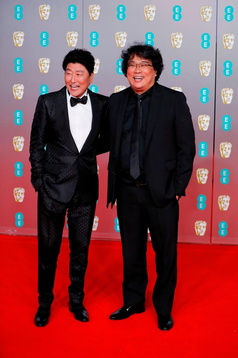 Song Kang-ho and Bong Joon-ho arrive at the 2020 EE British Academy Film Awards at Royal Albert Hall on Sunday, February 2. AFP