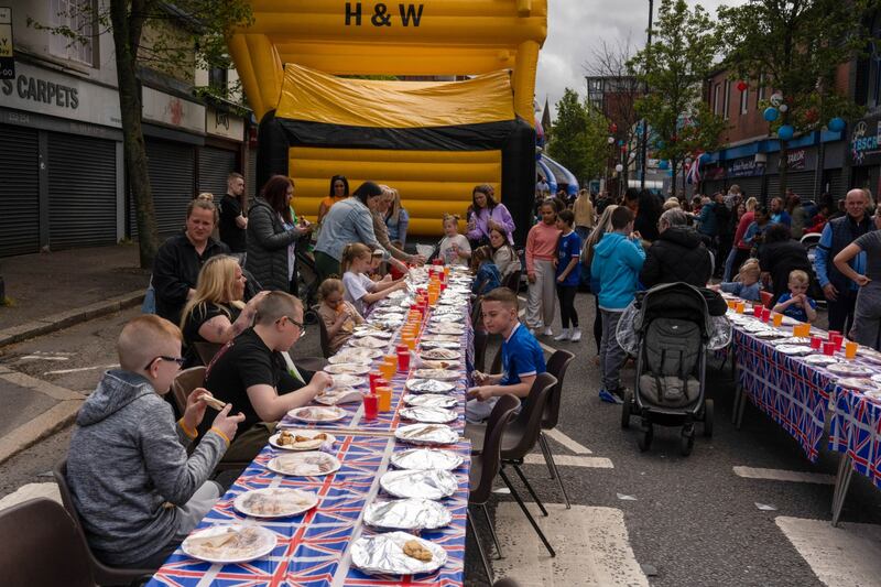 Residents eat at a street party in Belfast, Northern Ireland. Bloomberg