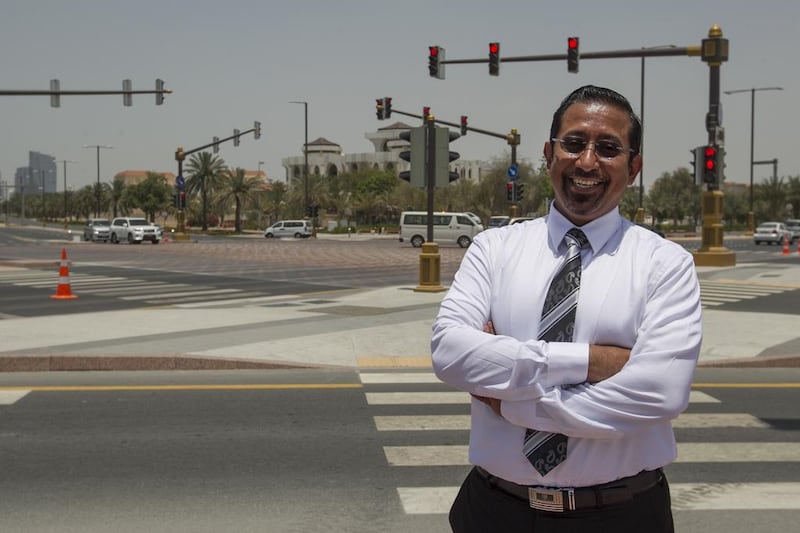 For two years, Hassan Al Jabri, who is an Abu Dhabi traffic safety ambassador, used to make a 220km round-trip to his office at Ibn Battuta Gate in Dubai from his home in Abu Dhabi. Mona Al-Marzooqi / The National