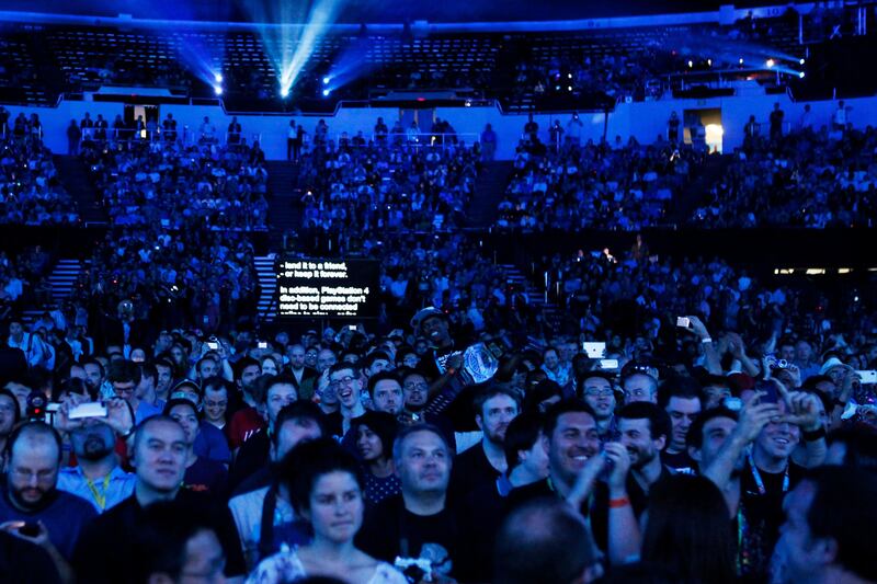 Attendees react during the Sony Corp. E3 media event in Los Angeles, California, U.S., on Monday, June 10, 2013. Sony Corp. took the wraps off the PlayStation 4, its first new console in seven years, promising original content and fresh titles will revitalize demand and spark a comeback for the video-game industry it once dominated. Photographer: Patrick T. Fallon/Bloomberg *** Local Caption ***  1237373.jpg