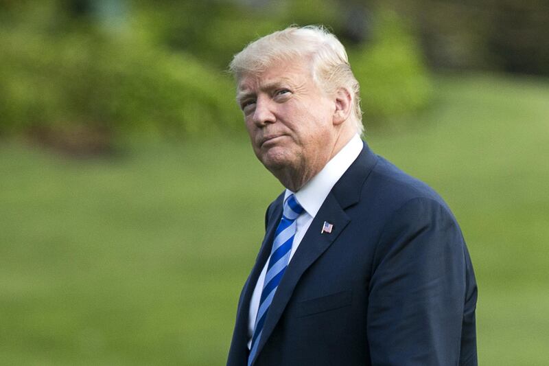 U.S. President Donald Trump walks on the South Lawn of the White House in Washington, D.C., U.S., on Friday, May 4, 2018. Trump delivered a strong message of support for the National Rifle Association (NRA) at its annual meeting on Friday, as gun-rights advocates regroup in the wake of the mass shooting at a Florida high school. Photographer: Michael Reynolds/Pool via Bloomberg