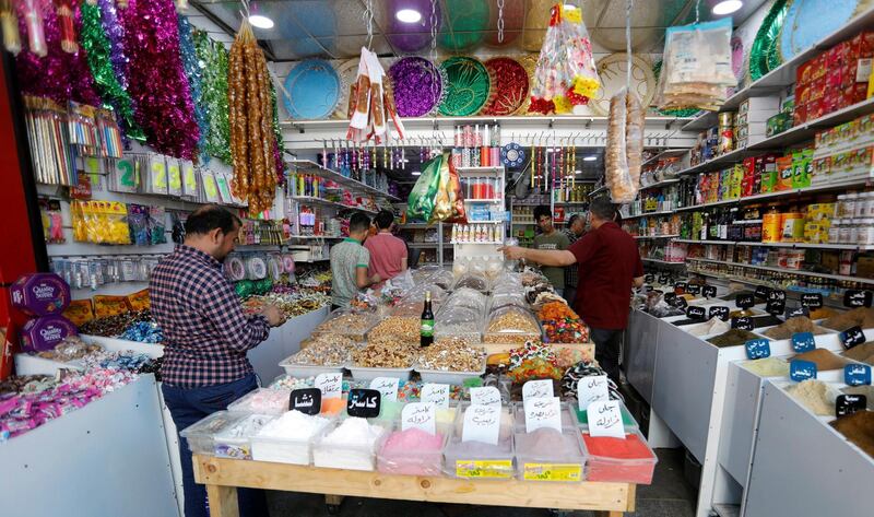 People shop ahead of Ramadan, at a wholesale market in Baghdad, Iraq Reuters
