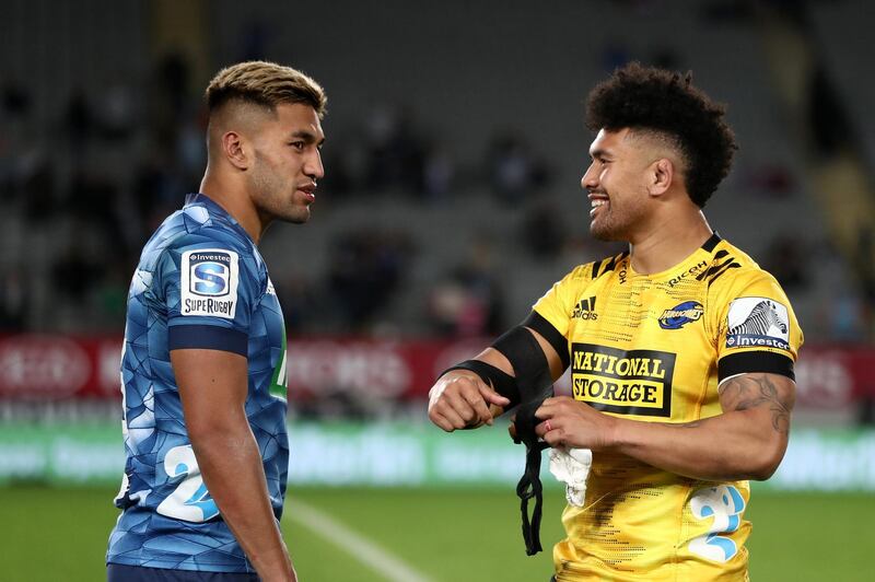 Rieko Ioane of the Blues talks with Ardie Savea of the Hurricanes at Eden Park. Getty