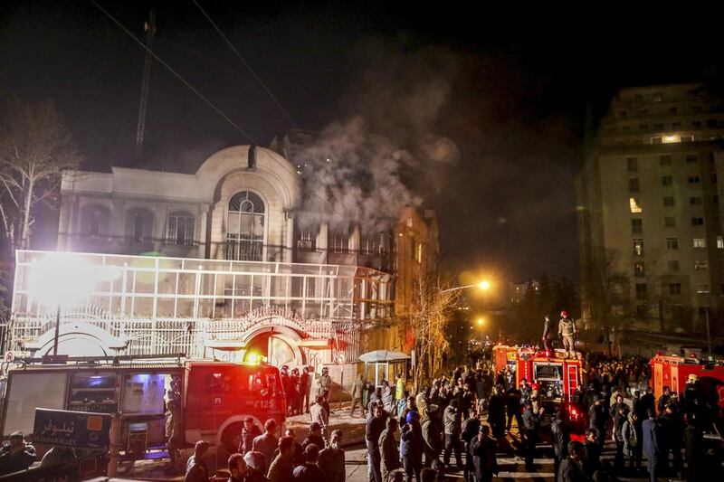Smoke rises as Iranian protesters, upset over the execution of Shiite cleric Nimr Al Nimr in Saudi Arabia, set fire to the Saudi embassy in Tehran. Mohammadreza Nadimi / ISNA via AP Photo