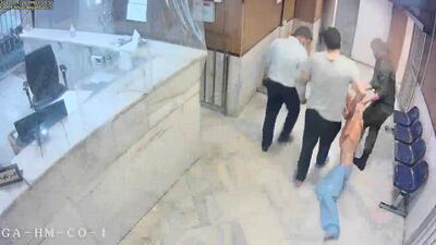 Leaked footage from Evin Prison shows guards dragging an emaciated prisoner along a corridor. Photo: AP
