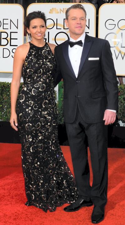 Matt Damon and his wife Luciana Barroso arrive on the red carpet for the Golden Globe awards on January 12, 2014 in Beverly Hills, California.    AFP PHOTO / Frederic J. BROWN (Photo by FREDERIC J. BROWN / AFP)