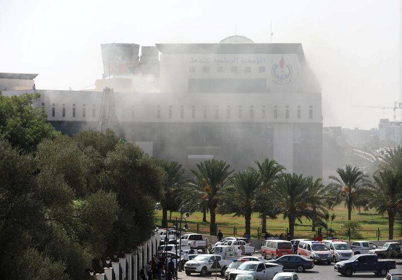 Smoke rises form the headquarters of Libyan state oil firm National Oil Corporation (NOC) after it was attacked by masked gunment. Reuters