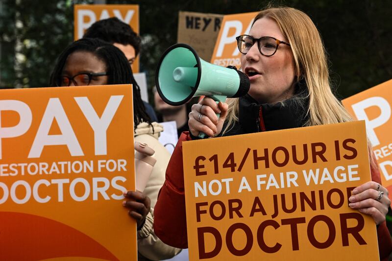 A demonstrator speaks during a protest by junior doctors at Saint Mary's Hospital in Manchester. AFP