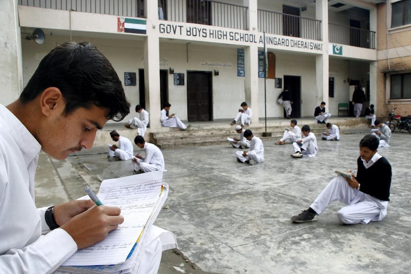 Students take exam in courtyard of a reconstructed government school in Ahingaro Dherai village of militancy-hit Swat district in Pakistan‚Äôs Khyber Pakhtunkhwa province. Aamir Saeed for The National