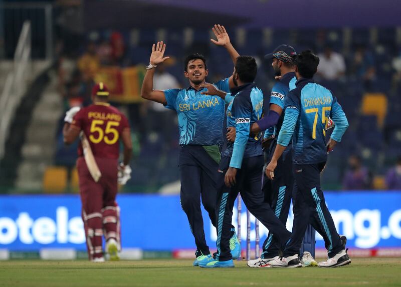 Sri Lanka players celebrate the dismissal of West Indies captain Kieron Pollard during the T20 World Cup match in Abu Dhabi. AP