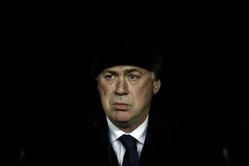 Real Madrid manager Carlo Ancelotti sits on the bench during his side's win over Celta Vigo on Saturday in La Liga. Emilio Naranjo / EPA / December 6, 2014 