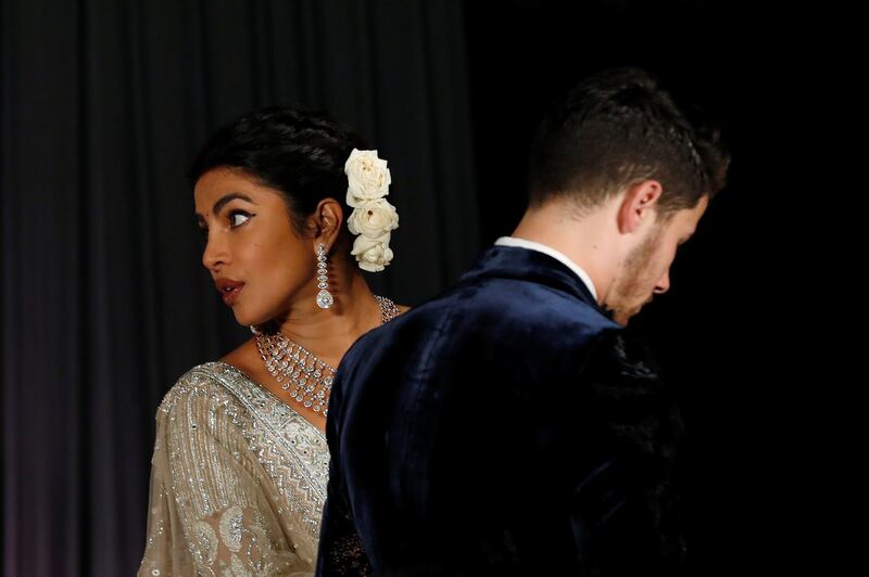 Newlyweds Priyanka Chopra, 36, and Nick Jonas, 26, pose for a photograph during a reception at a hotel in New Delhi on December 4, 2018. Photo: Reuters