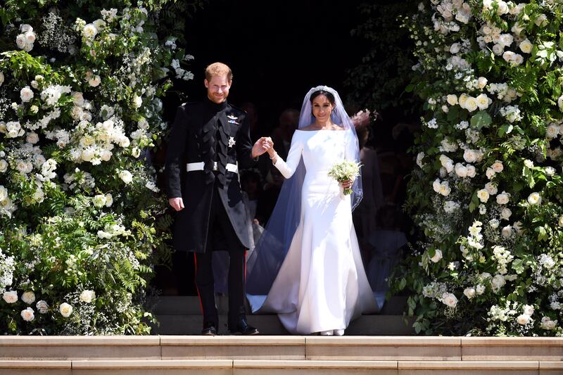 FILE PHOTO: Prince Harry and Meghan Markle leave St George's Chapel at Windsor Castle after their wedding.  Saturday May 19, 2018.  Neil Hall/Pool via REUTERS/File Photo