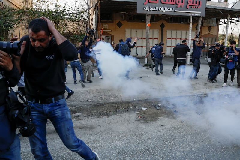 Smoke is seen during a confrontation between Israeli settlers and Palestinians in the West Bank town of Hawara. Reuters
