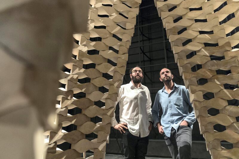 DUBAI, UNITED ARAB EMIRATES. 02 November 2017. Construction of While We Wait installation, a new architectural pavilion designed by the Palestinian architects and designers Elias and Yousef Anastas (AAU ANASTAS). The installation at Concrete in Al Serkal Avenue in partnership with the Victoria and Albert Museum, London bring the While We Wait installation to Dubai from 6-18 November 2017. The installation is comprised of pieces of stone quarried in various regions of Palestine, which fit together to form a large, lattice-like, self-supporting structure. (Photo: Antonie Robertson/The National) Journalist: Nick Leech. Section: Arts & Culture.