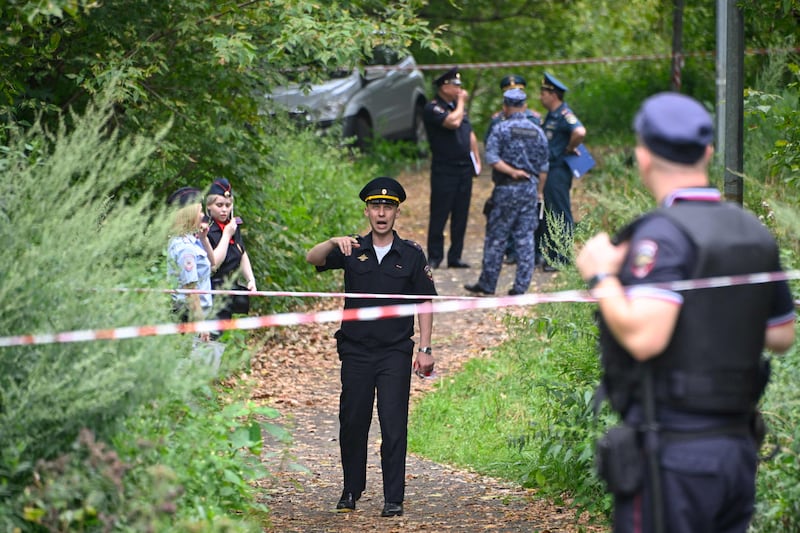 Police at the site where a Ukrainian drone targeting the Russian capital was downed by an air defence system, in western Moscow, in August. AFP