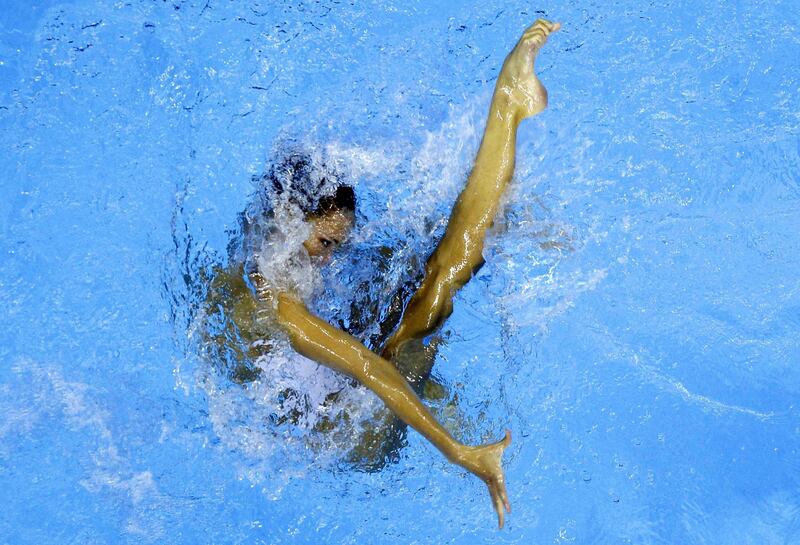 Jenna Randall completes her sequence during the final of the synchronised swimming solo technical routine at the 14th Fina World Championships in Shanghai.

David Gray / Reuters