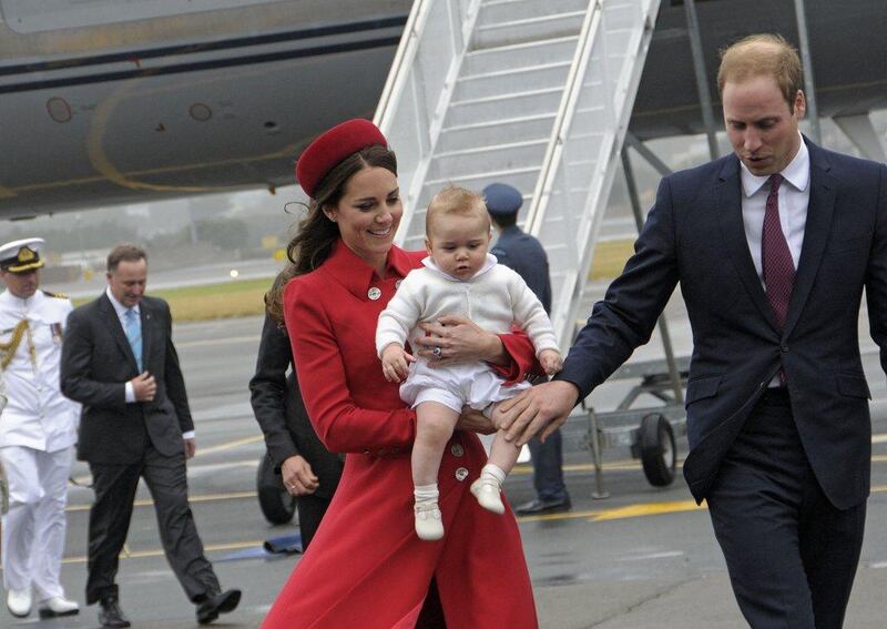 Britain’s Prince William and his wife Catherine, Duchess of Cambridge carrying baby Prince George, arrive at the international airport in Wellington. Woolf Crown Copyright / AFP Photo April 7